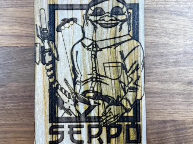 HueForge model: Dan da Dan - Serpo Alien, Wood Grain Texture by Pretty Okay Prints
